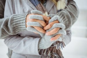 Cute couple in warm clothing holding hands on a chilly day