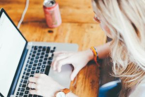 blonde woman typing